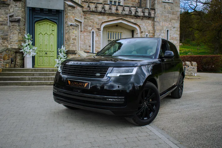 Black Range Rover outside the entrance of an Irish manor house