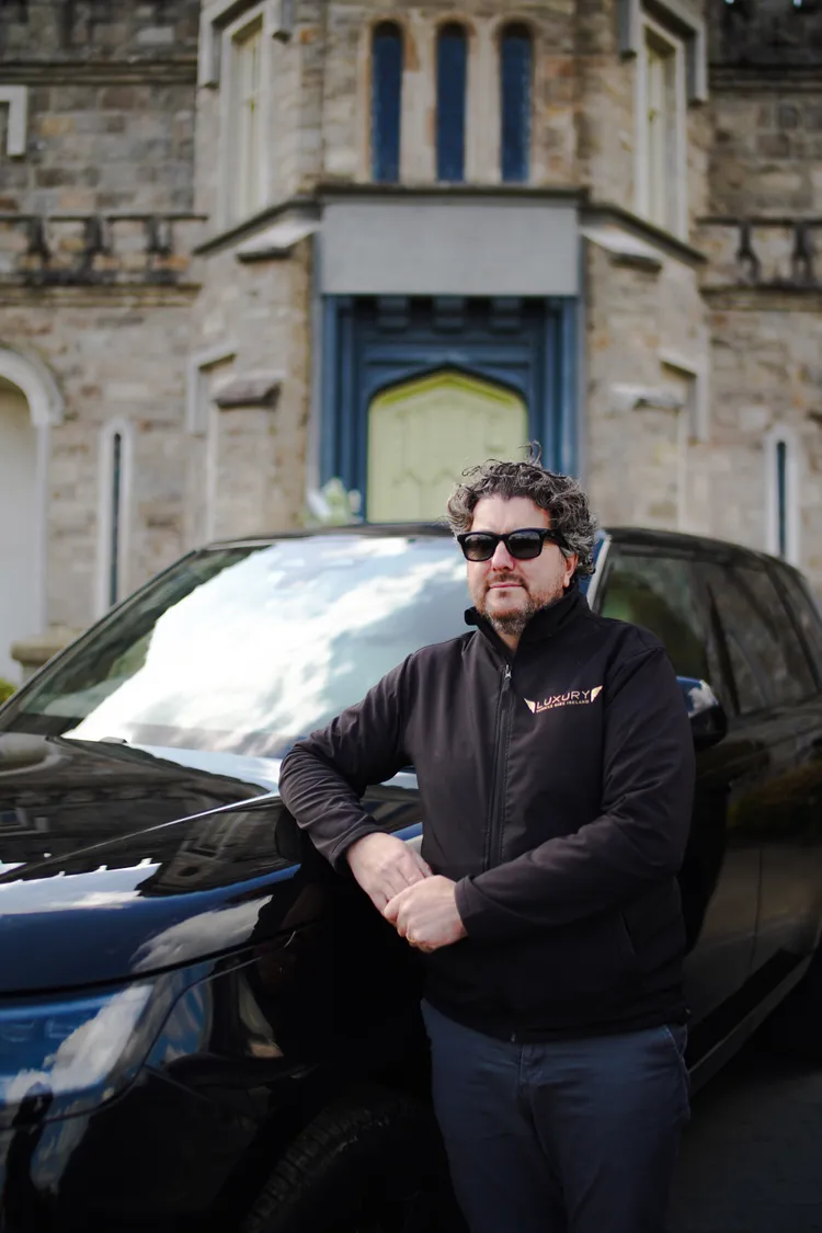 Owner of Luxury Vehicle Hire Ireland beside a black Range Rover
