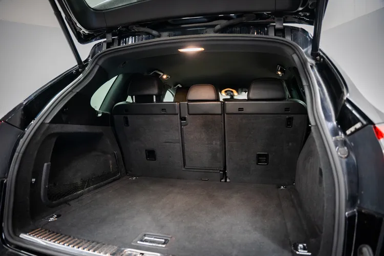 Open boot of a luxury SUV showing generous luggage space