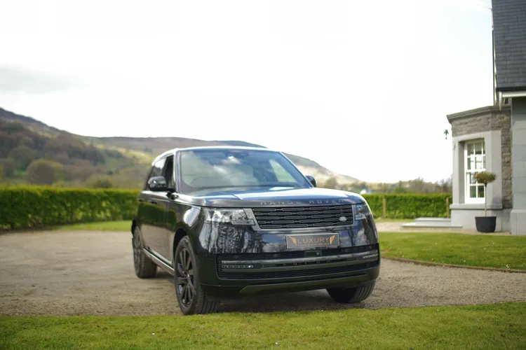 Black Range Rover on a hillside driveway in Ireland