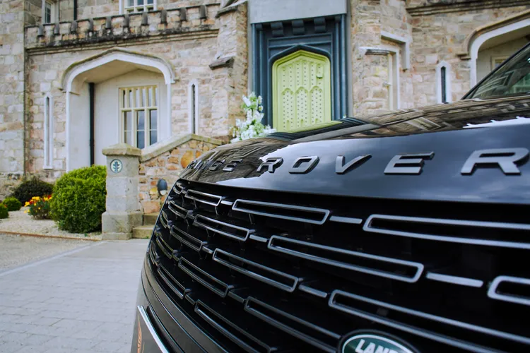 Detail of a Range Rover grille and badge