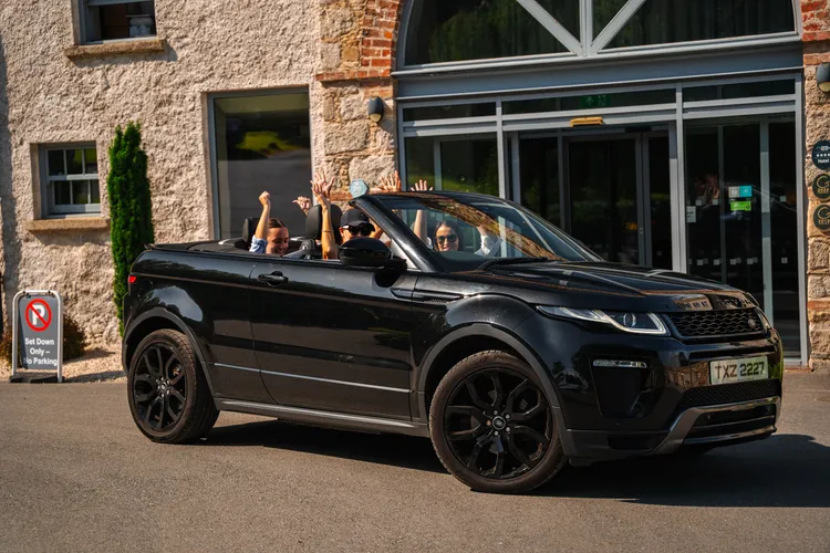 Range Rover Evoque convertible outside a boutique hotel